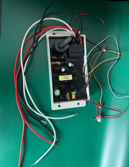    Engineering bench photograph of the KYOG220V09 open potted power module on an anti-static green work surface, displaying the comprehensive wiring harness including primary AC input leads, secondary fault status control cables, and silicone-jacketed high-voltage outputs ready for industrial HVAC air cleaner integration.
   